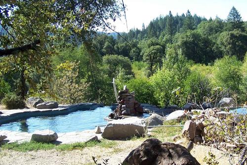 one of 3 man-made hot water baths.  all baths overlook the river. california