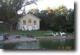 Stunning Raised Ranch on 1 1/2 Lakefront