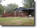 Home and Acreage in Woods with Pool