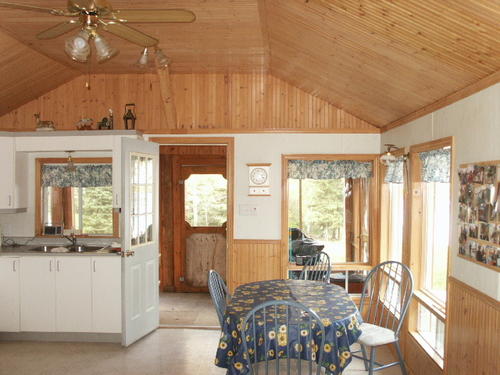 dining to kitchen to screened porch quebec