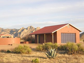 The detached garage with the nearby Dragoon Mountains in the background.