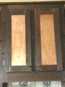 The copper inset in the custom kitchen cabinets.