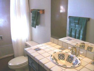 The guest bath with it's hand painted Mexican tiles and sink.