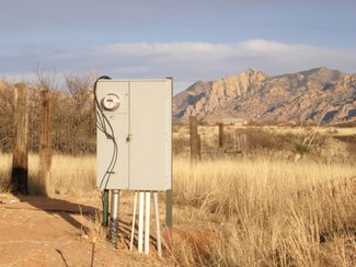 A separate electric meter for the house at the building site.