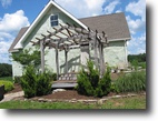 27 rolling acres+beautiful Strawbale home